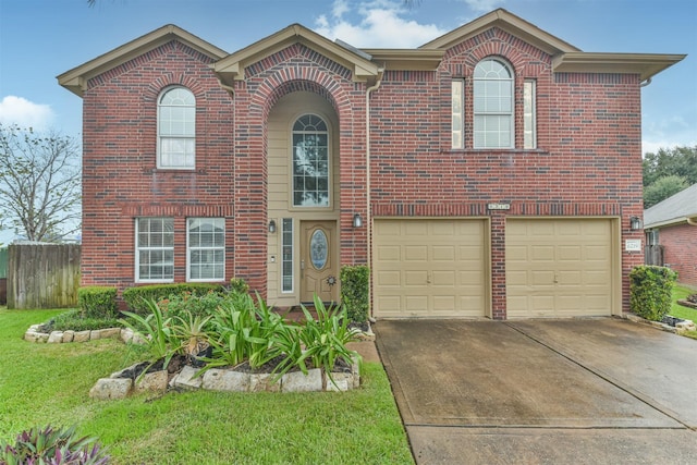 view of front of house featuring a front yard and a garage