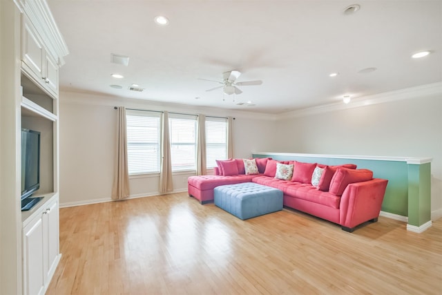 living room featuring light wood-type flooring, ceiling fan, and crown molding