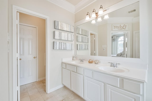 bathroom with tile patterned flooring, vanity, and crown molding