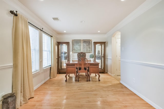 office space featuring light hardwood / wood-style floors and crown molding