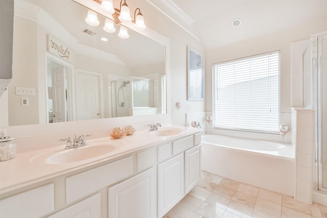 bathroom featuring a notable chandelier, ornamental molding, vaulted ceiling, and shower with separate bathtub