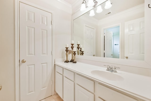 bathroom with tile patterned flooring, vanity, and crown molding