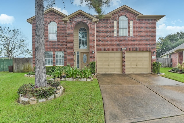 view of front of home featuring a garage and a front lawn