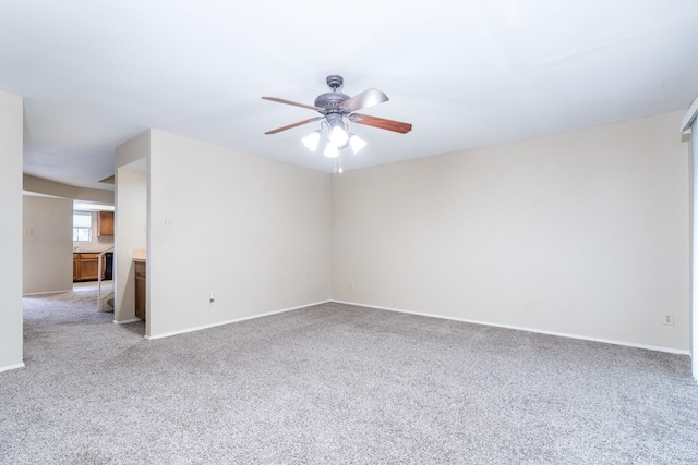 carpeted empty room with ceiling fan