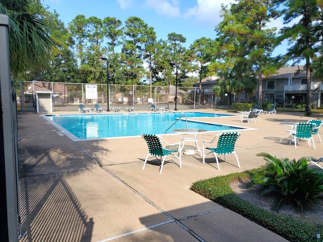 view of swimming pool featuring a patio area