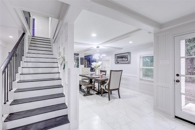 stairs featuring a notable chandelier, beam ceiling, crown molding, and coffered ceiling