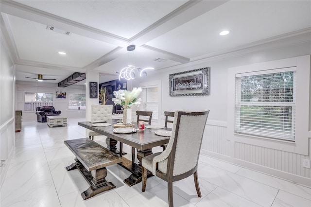 dining space featuring beamed ceiling, ornamental molding, ceiling fan, and coffered ceiling