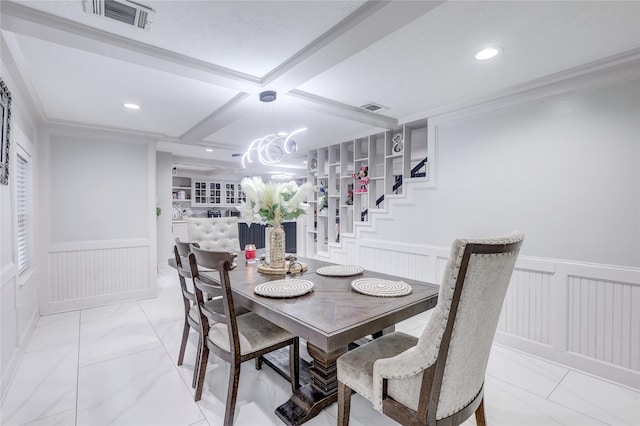 dining area with beamed ceiling, a chandelier, ornamental molding, and coffered ceiling