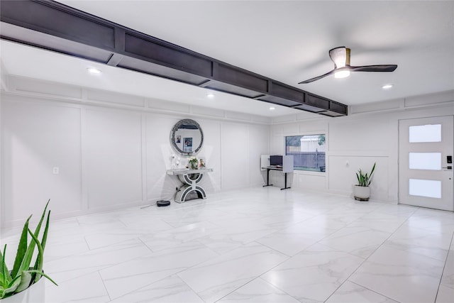 interior space featuring ceiling fan