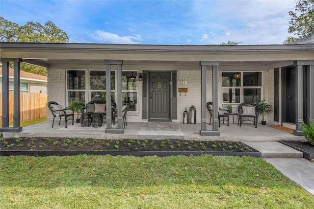 exterior space with a lawn and a porch