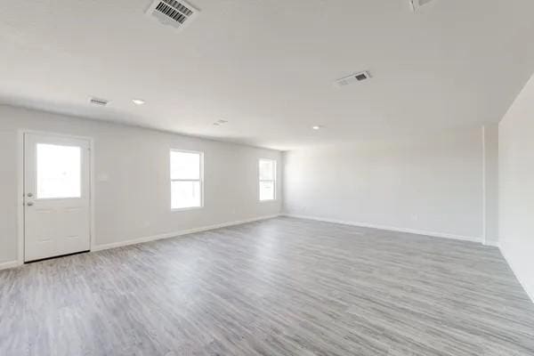 spare room featuring light hardwood / wood-style flooring