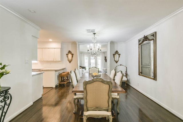 dining room featuring french doors, dark hardwood / wood-style floors, an inviting chandelier, and crown molding