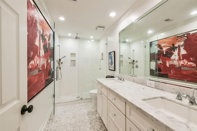 bathroom featuring tile patterned floors, vanity, an enclosed shower, and toilet