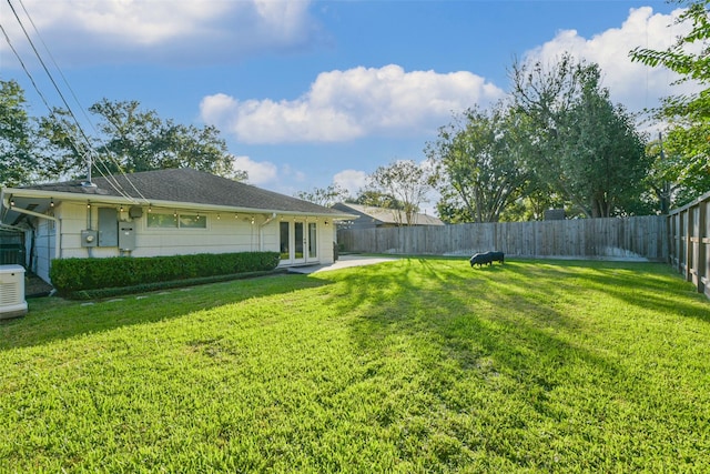 view of yard with french doors