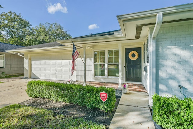 doorway to property featuring a garage