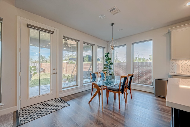 dining area featuring dark hardwood / wood-style flooring and plenty of natural light