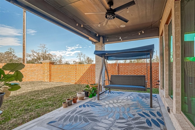 view of patio / terrace featuring ceiling fan