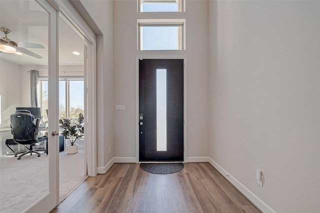 foyer featuring light wood-type flooring and ceiling fan