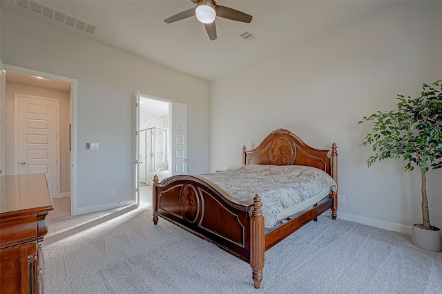 bedroom featuring ceiling fan, light carpet, and connected bathroom