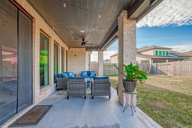 view of patio with ceiling fan and an outdoor hangout area