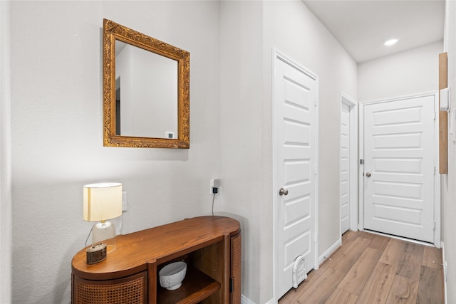 hall with light wood-type flooring