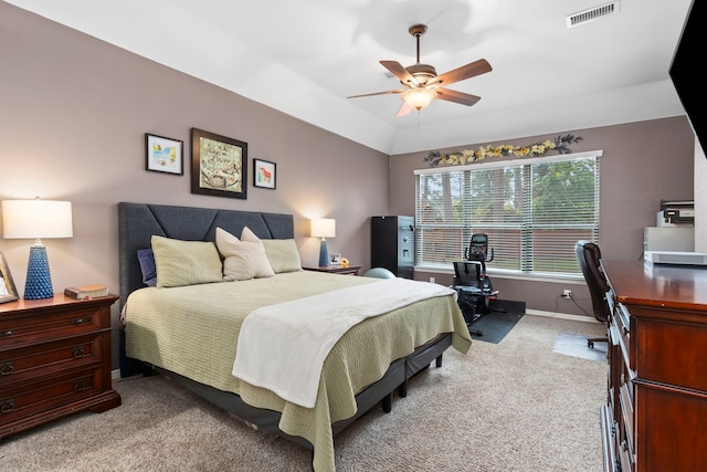 carpeted bedroom featuring ceiling fan and vaulted ceiling