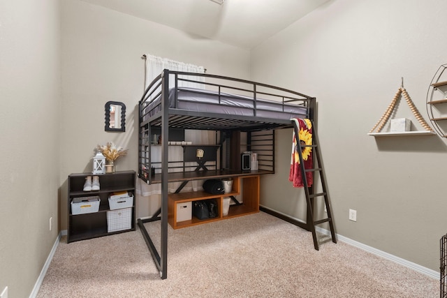 bedroom featuring light colored carpet