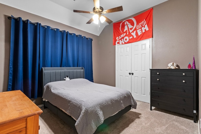 bedroom with carpet flooring, ceiling fan, and lofted ceiling