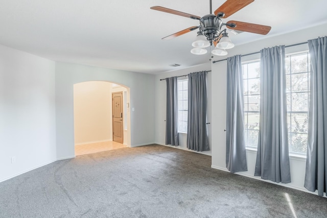 unfurnished room featuring carpet and ceiling fan