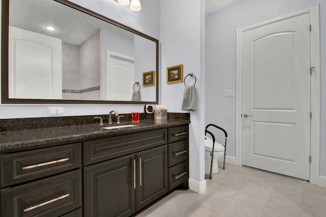 bathroom with tile patterned floors and vanity