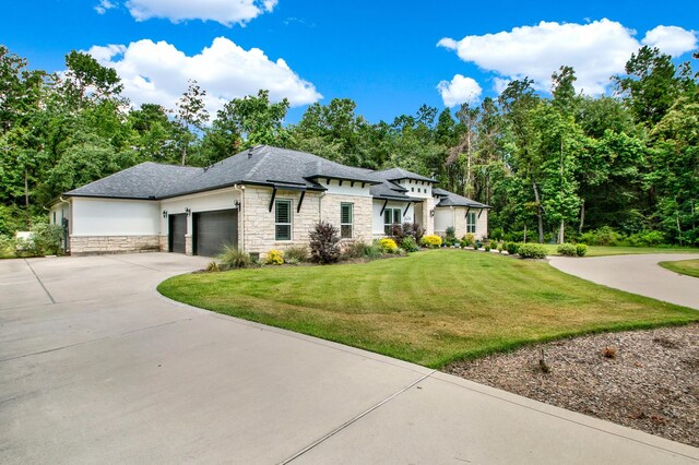 prairie-style house with a front yard and a garage