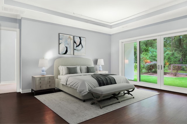 bedroom with a tray ceiling, access to outside, crown molding, and dark hardwood / wood-style floors