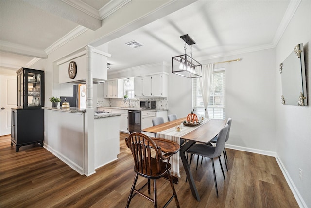 dining space with dark hardwood / wood-style floors, sink, crown molding, and a chandelier