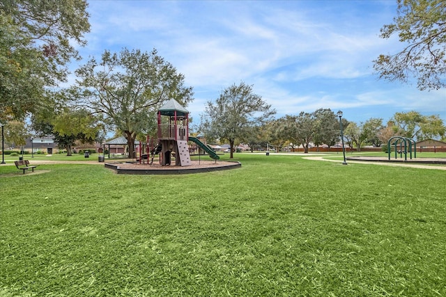 view of jungle gym with a lawn