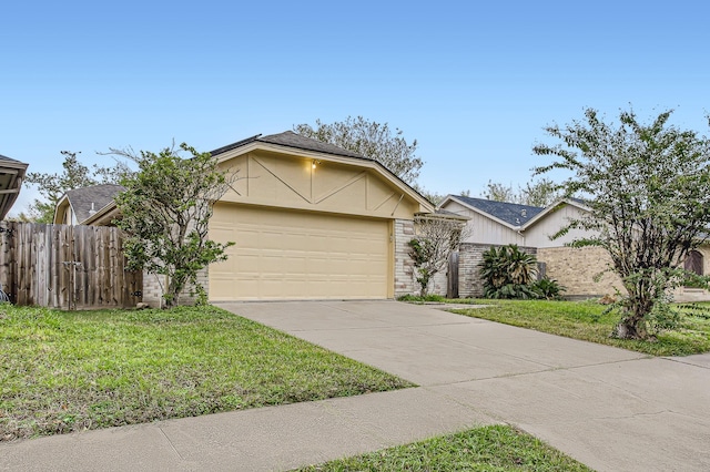 single story home featuring a garage and a front lawn