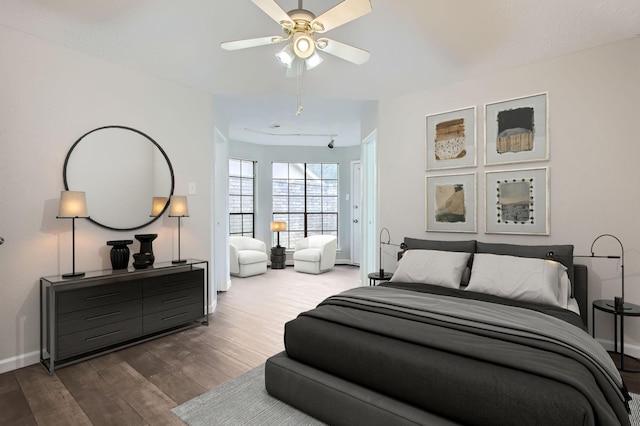 bedroom featuring dark wood-type flooring and ceiling fan