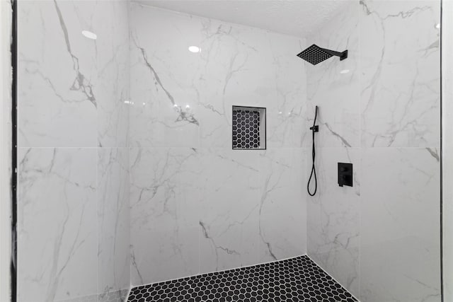 bathroom featuring tiled shower