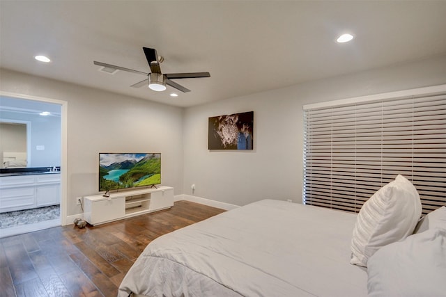 bedroom with ensuite bath, ceiling fan, and dark hardwood / wood-style floors