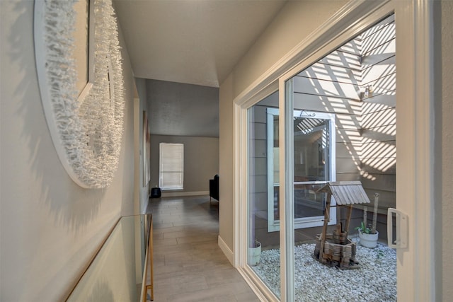 corridor featuring hardwood / wood-style flooring