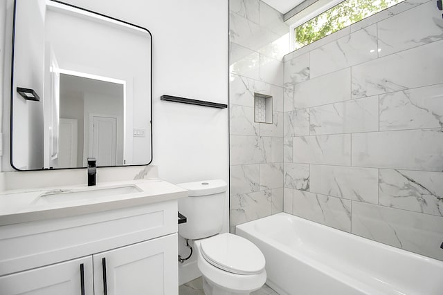 full bathroom featuring vanity, toilet, and tiled shower / bath combo