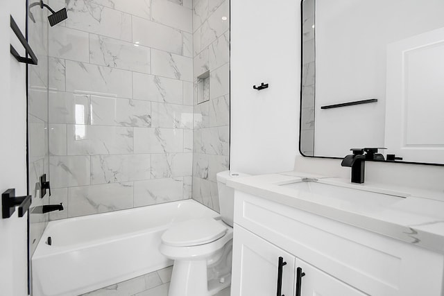 full bathroom featuring vanity, toilet, and tiled shower / bath