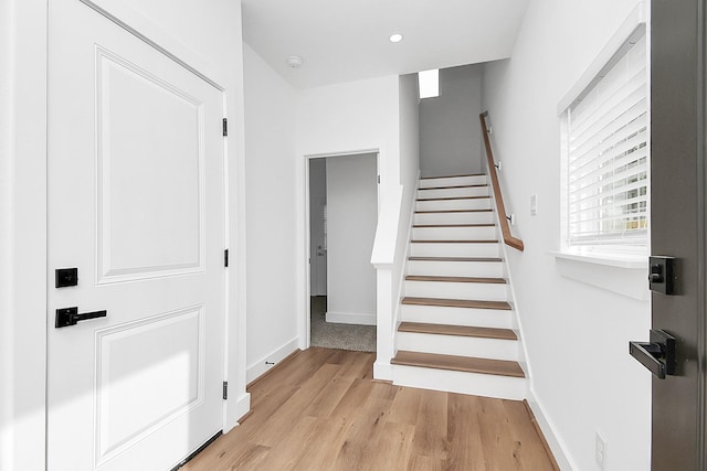 staircase featuring hardwood / wood-style flooring