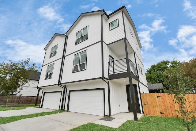 view of front of house with a balcony and a garage