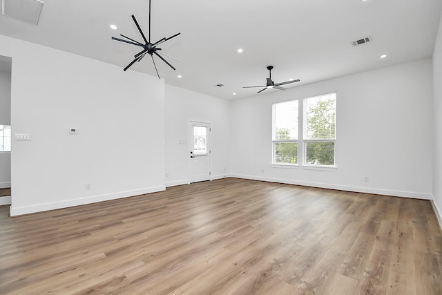 spare room featuring light hardwood / wood-style floors and ceiling fan