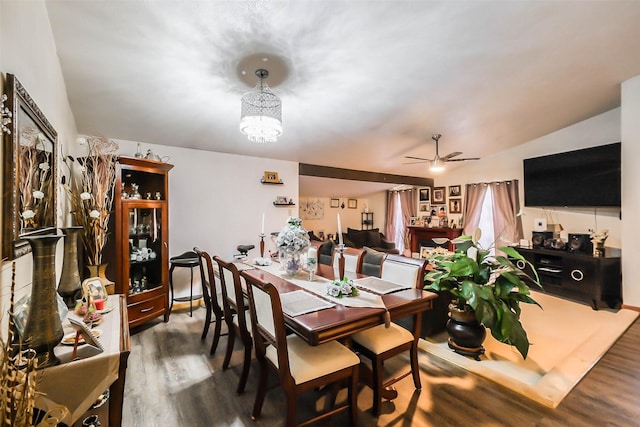 dining area featuring hardwood / wood-style flooring, ceiling fan, and lofted ceiling