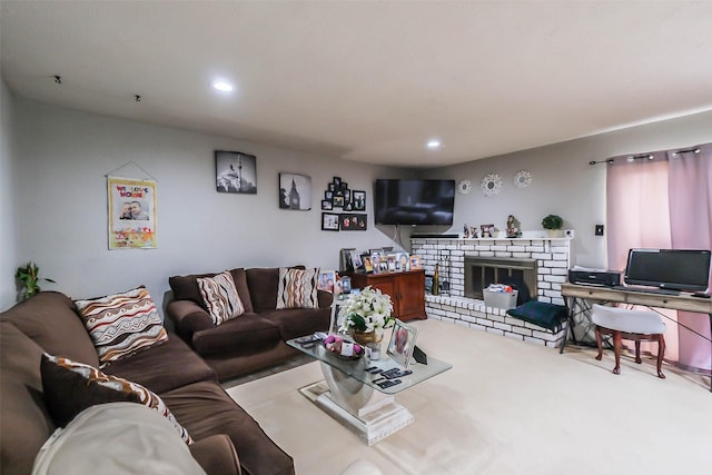 carpeted living room featuring a brick fireplace