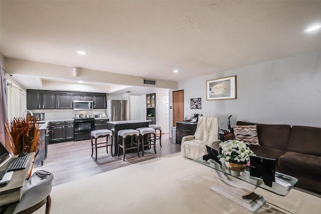 living room with light hardwood / wood-style floors