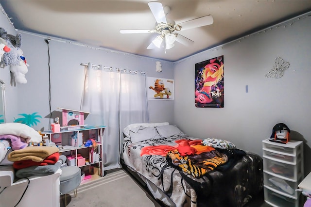 bedroom with ceiling fan and concrete floors