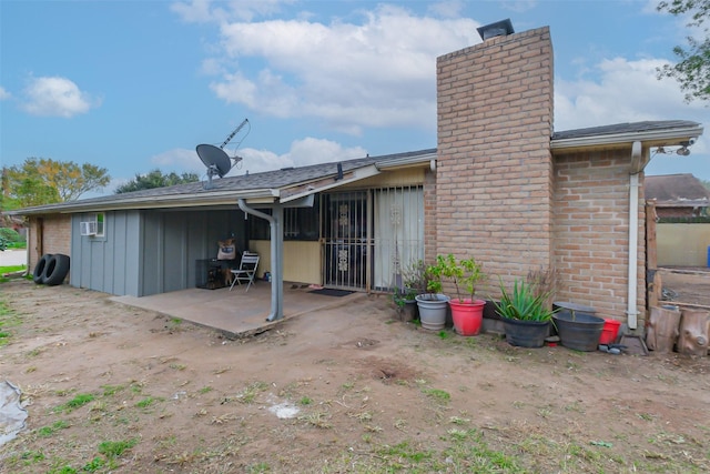 rear view of house with a patio