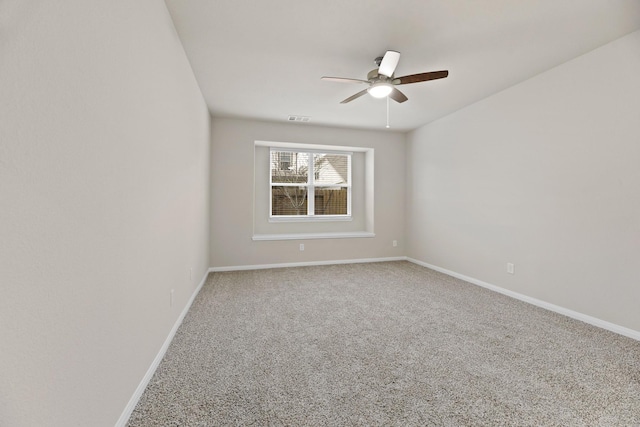 carpeted empty room with ceiling fan